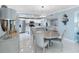 Stylish dining area adjacent to a modern kitchen with stainless steel appliances at 1460 Gulf Blvd # 509, Clearwater Beach, FL 33767