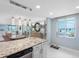 Open concept kitchen with granite countertops, island seating, and beautiful water views at 1460 Gulf Blvd # 509, Clearwater Beach, FL 33767