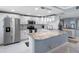 Bright kitchen featuring white cabinets, granite counters, and stainless steel appliances at 1460 Gulf Blvd # 509, Clearwater Beach, FL 33767