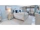 Light and airy main bedroom featuring white furnishings, balcony access, and luxurious bedding at 1460 Gulf Blvd # 509, Clearwater Beach, FL 33767