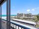 Breathtaking ocean and building view from the condo balcony under a sunny sky at 1460 Gulf Blvd # 509, Clearwater Beach, FL 33767