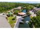 Aerial view of community featuring a serene pond, fountain, pool and gazebo at 14910 Par Club Cir, Tampa, FL 33618