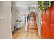 Welcoming foyer with hardwood floors, staircase, and stylish decor at 14910 Par Club Cir, Tampa, FL 33618