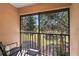 Screened patio with seating at 14910 Par Club Cir, Tampa, FL 33618