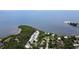 Breathtaking aerial view highlighting a waterfront community surrounded by lush vegetation and serene water bodies at 1500 Sunset Rd # F8, Tarpon Springs, FL 34689