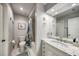 Clean bathroom with marble countertops, updated fixtures, and a shower/tub combination at 1500 Sunset Rd # F8, Tarpon Springs, FL 34689