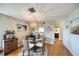Cozy dining area with seating for four and an open view to the kitchen at 1500 Sunset Rd # F8, Tarpon Springs, FL 34689