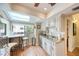 Bright kitchen with a breakfast bar, skylight, stainless appliances and a view of the neighborhood at 1500 Sunset Rd # F8, Tarpon Springs, FL 34689
