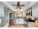 Bright kitchen with stainless steel appliances, granite countertops, and ample cabinet space at 1500 Sunset Rd # F8, Tarpon Springs, FL 34689