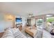 Beautifully decorated living room with a coastal vibe and an open layout at 1500 Sunset Rd # F8, Tarpon Springs, FL 34689