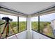 Stunning view from the sunroom of lush greenery, perfect for birdwatching at 1500 Sunset Rd # F8, Tarpon Springs, FL 34689