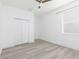 Spacious bedroom features laminate flooring, a ceiling fan and a closet for storage at 1808 E Comanche Ave, Tampa, FL 33610