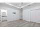 Expansive bedroom featuring recessed lighting, neutral paint, wood-look floors, and an en suite bathroom at 1808 E Comanche Ave, Tampa, FL 33610