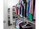 Organized walk-in closet with ample storage space for clothing and shoes at 1808 E Comanche Ave, Tampa, FL 33610