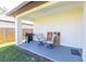 Covered patio with grill and chairs, great for outdoor entertaining at 1808 E Comanche Ave, Tampa, FL 33610