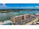 A high angle view shows the bayside community, parking and crane equipment at 1847 Shore S Dr # 204, South Pasadena, FL 33707