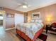 This bedroom features light wood floors, neutral walls, a ceiling fan and closet at 1847 Shore S Dr # 204, South Pasadena, FL 33707