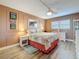 Cozy bedroom featuring a ceiling fan, light wood floors, and soft, neutral-toned walls at 1847 Shore S Dr # 204, South Pasadena, FL 33707