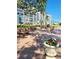 Community grounds featuring picnic tables, barbecue and lush gardens with potted flowers at 1847 Shore S Dr # 204, South Pasadena, FL 33707