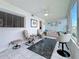 Relaxing sunroom with comfortable seating, a ceiling fan, and a view from the window at 1847 Shore S Dr # 204, South Pasadena, FL 33707