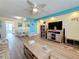 Spacious living room with stylish ceiling fan, comfortable seating, and a view into the dining area at 1847 Shore S Dr # 204, South Pasadena, FL 33707