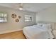 Bright bedroom with wood floors, ceiling fan, and ample natural light at 1923 W State St, Tampa, FL 33606
