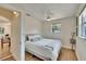 Cozy bedroom with a comfortable bed, natural light, and wood floors at 1923 W State St, Tampa, FL 33606