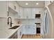 Beautiful kitchen with white cabinets, quartz countertops, and stainless steel appliances at 1923 W State St, Tampa, FL 33606