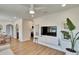 Open-concept living room with wood floors leads to the kitchen and dining areas at 1923 W State St, Tampa, FL 33606