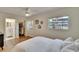 Bright primary bedroom with a walk-in closet and a view of the backyard at 1923 W State St, Tampa, FL 33606
