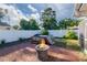 Large backyard features a hot tub, patio, and fire pit seating area at 2030 Magnolia Dr, Clearwater, FL 33764