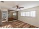 Bright bedroom with wood floors, and ample natural light with an adjacent mirrored wall at 2030 Magnolia Dr, Clearwater, FL 33764
