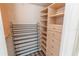 Well-organized walk-in closet with custom shelving and drawers for ample storage at 2030 Magnolia Dr, Clearwater, FL 33764