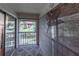 Balcony overlooking a pond and lawn, with a privacy screen at 2213 Hammock Pine Blvd, Clearwater, FL 33761