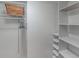 Organized closet with shelves, hanging space, and plenty of room for storage at 2213 Hammock Pine Blvd, Clearwater, FL 33761