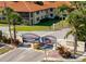 Welcoming gated entrance of Hammock Pine community with mature landscaping at 2213 Hammock Pine Blvd, Clearwater, FL 33761