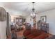 Open-concept floor plan featuring a dining table, living area, and lots of natural light at 2213 Hammock Pine Blvd, Clearwater, FL 33761