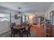 A brightly lit living space with wood floors and dining area at 2213 Hammock Pine Blvd, Clearwater, FL 33761