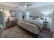 Spacious main bedroom with hardwood floors, ample natural light, and comfortable furnishings at 2213 Hammock Pine Blvd, Clearwater, FL 33761