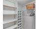 Bright walk-in closet includes shelving, hanging rods and storage options at 2213 Hammock Pine Blvd, Clearwater, FL 33761