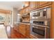 Well-equipped kitchen with stainless steel appliances, custom cabinets, and granite countertops at 2220 Muirfield Way, Oldsmar, FL 34677