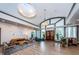 Elegant lobby with high ceilings, modern lighting, comfortable seating, and decorative accents at 2220 Muirfield Way, Oldsmar, FL 34677