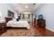 Relaxing main bedroom with ceiling fan, sitting area and large windows at 2220 Muirfield Way, Oldsmar, FL 34677
