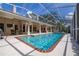 Sparkling screened-in pool with a beautiful patio and private backyard at 2220 Muirfield Way, Oldsmar, FL 34677