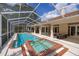 This screened-in pool and jacuzzi are perfect for year-round enjoyment and relaxation at 2220 Muirfield Way, Oldsmar, FL 34677