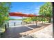 Spacious backyard deck overlooking a lake with shade umbrellas at 2347 Foggy Ridge Pkwy, Land O Lakes, FL 34639