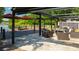 Expansive outdoor living space with seating, dock, pergola, and umbrella, perfect for relaxation and entertaining at 2347 Foggy Ridge Pkwy, Land O Lakes, FL 34639