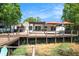 Backyard features an expansive deck, patio, and direct access to the water at 2347 Foggy Ridge Pkwy, Land O Lakes, FL 34639