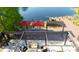 Waterfront home boasts a large deck with dining, seating, and lake views at 2347 Foggy Ridge Pkwy, Land O Lakes, FL 34639