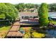 Large deck on waterfront home features dining and lounging areas plus dock with seating at 2347 Foggy Ridge Pkwy, Land O Lakes, FL 34639